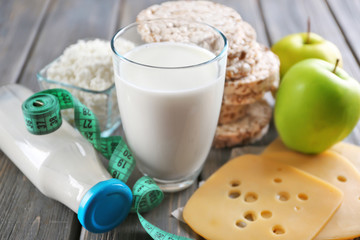Different dairy products on wooden background