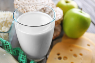 Different dairy products on wooden background