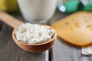 Wooden spoon with curd, closeup