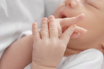 Fototapeta na wymiar Hands of cute little baby, closeup