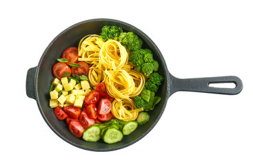 Pasta with vegetables and herbs in pan  on white background