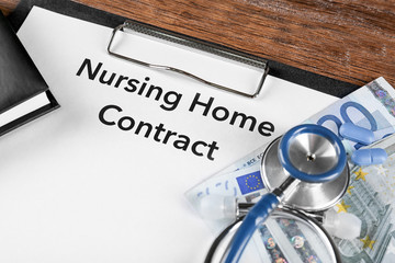 Nursing Home Contract on clipboard, closeup. Medical concept