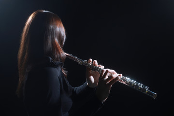 Flute player Flutist playing flute music instrument 