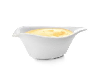 Sauceboat full of creamy cheese, isolated on white