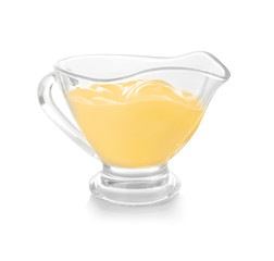 Sauceboat full of creamy cheese, isolated on white