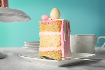 Tasty Easter cake slice on white saucer