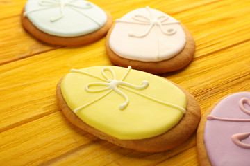 Creative Easter sugar cookies on yellow wooden background