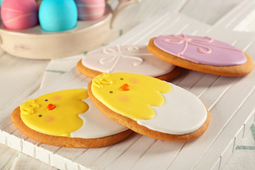 Creative Easter sugar cookies on white wooden board