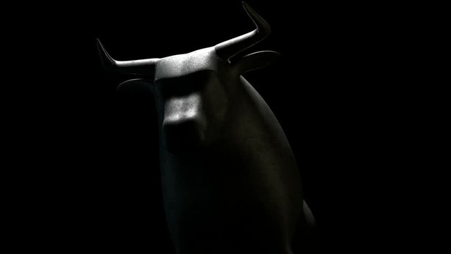 A closeup pan around a metal casting depicting a stylized bear morphing into a bull in contrasting light representing financial market trends on a dark dramatic background