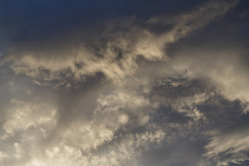 Cumulus clouds against a blue sky. Overcast. Cyclone. Weather forecast.