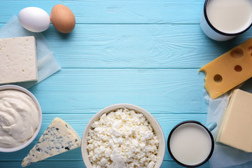 Fresh dairy products on blue wooden background