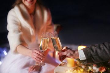 Happy couple celebrating wedding outdoors, closeup