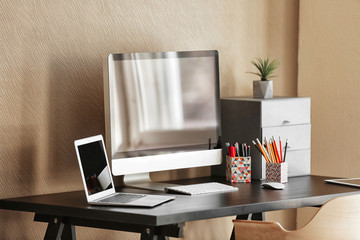 Modern design of workplace with big computer monitor