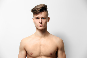 Fototapeta premium Handsome young man posing on white background