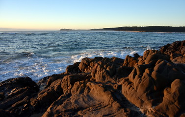 Sunrise at the beach of Tuross Head in summertime early morning. Tuross Head is a seaside village on the south coast of New South Wales, Australia.