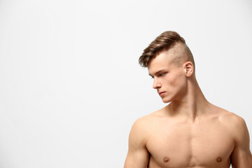 Fototapeta premium Handsome young man posing on white background