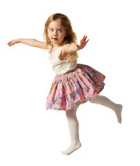 Cute three-year girl jumping with joy isolated on white background