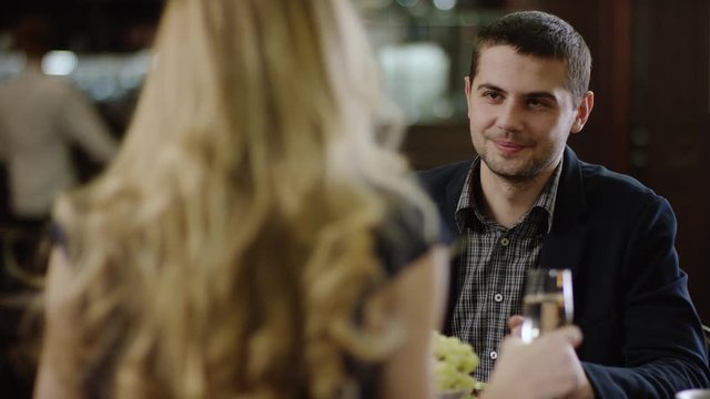 young beautiful pair having fun in restaurant partner in restaurant