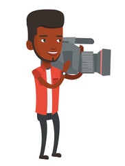 Cameraman with movie camera on tripod.