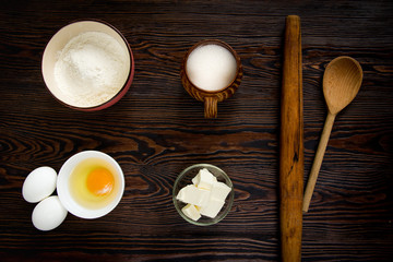 Baking ingredients for pastry on the wooden background
