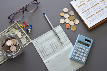 Accountant verify and review the Saving Account Book bank and Statement of financial statements /...