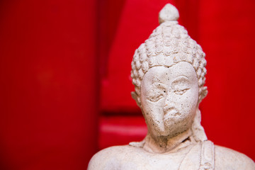 Sitting white Buddha statue mistake in create at temple Thailand.