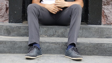 Man Sitting On Steps