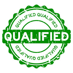 Grunge green qualified round rubber seal stamp on white background