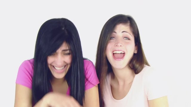 Two happy young beautiful women laughing  medium shot