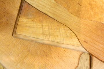 the old chopping board with a knife cuts and abrasions, abstract composition