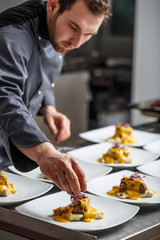Young chef prepares meals
