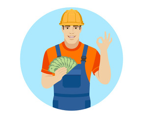 Builder with money show a okay hand sign