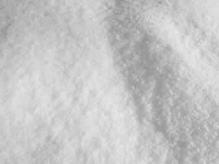 Snow surface texture background natural with uneven distribution and shadows