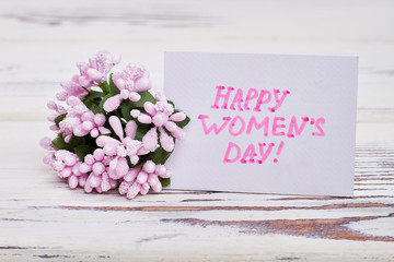 Bunch of flowers and card. Congratulation for Women's day.