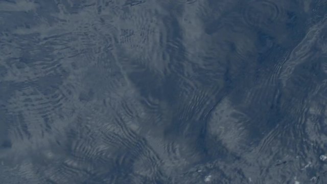 Foam of ocean wave in ocean. Slow motion.
