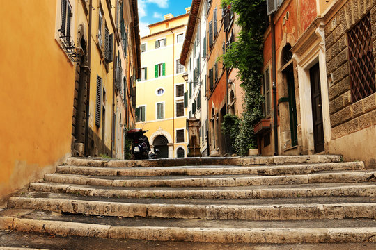 Roman street in the morning with stairs leading to the fountain