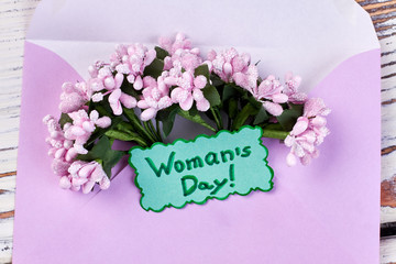 Bunch of flowers and envelope. How to celebrate women's day.