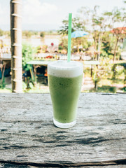 Close up ice green tea on wood table
