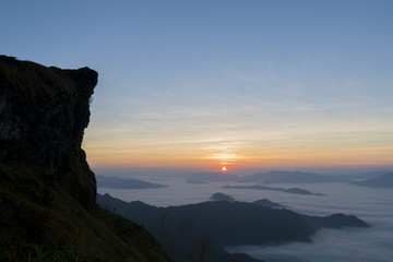 Fototapeta na wymiar Sunrise on mountain with fog in the morning.