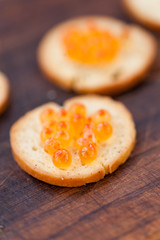 Salmon caviar on bread
