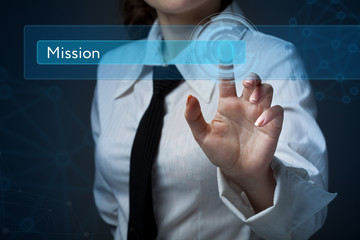 Business, technology, internet and networking concept. Business woman presses a button on the virtual screen: mission