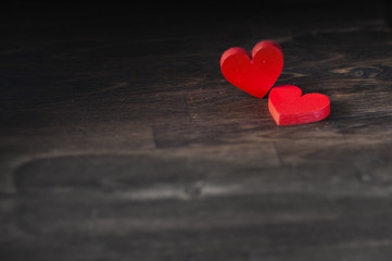 Fototapeta premium two hearts on dark wooden background