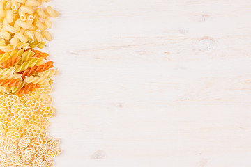 Pasta background decorative border of assortment different kinds italian macaroni. Healthy traditional food backdrop.