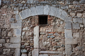 Fototapeta premium Old Stone Wall With Inbuild Arch