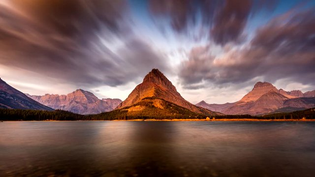 Sunrise in Glacier National Park, Montana with dramatic sky in motion