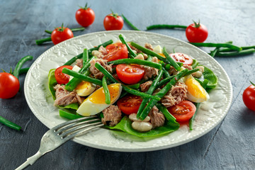 Fresh Tuna Green Bean salad with eggs, tomatoes, beans on white plate. concept healthy food