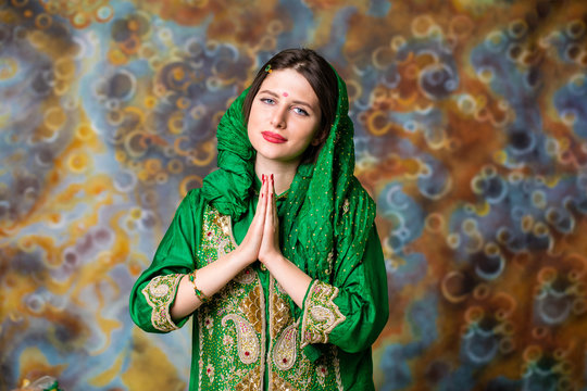 Portrait of beautiful eastern woman in green sari