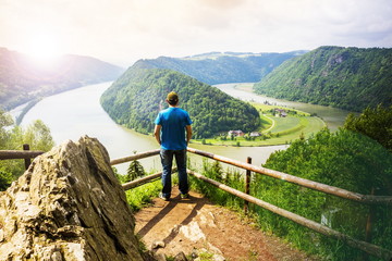 Fototapeta na wymiar Man looking at Danube river in Austria