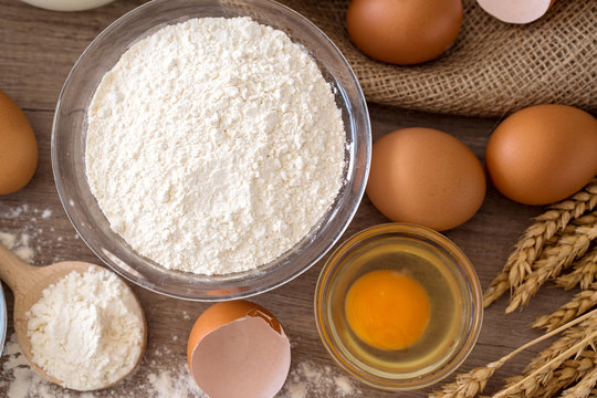 eggs and flour basic ingredients for baking top view .