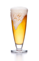 glass of light beer foam. lager beer in a glass beaker with fresh bubbling foam isolate.